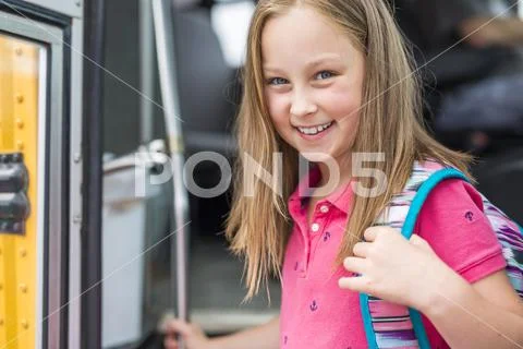 Great Portrait Of School Pupil Outside Classroom Carrying Bags ...