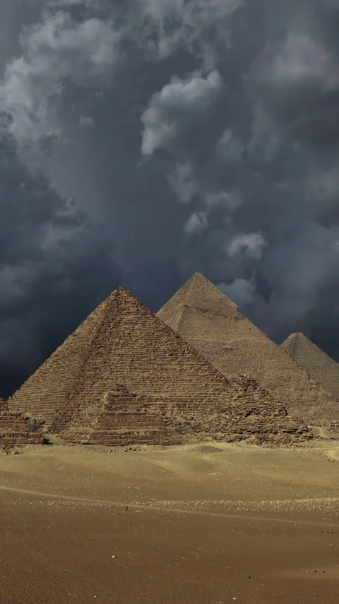 Great pyramids and storm clouds Stock Footage 237425904