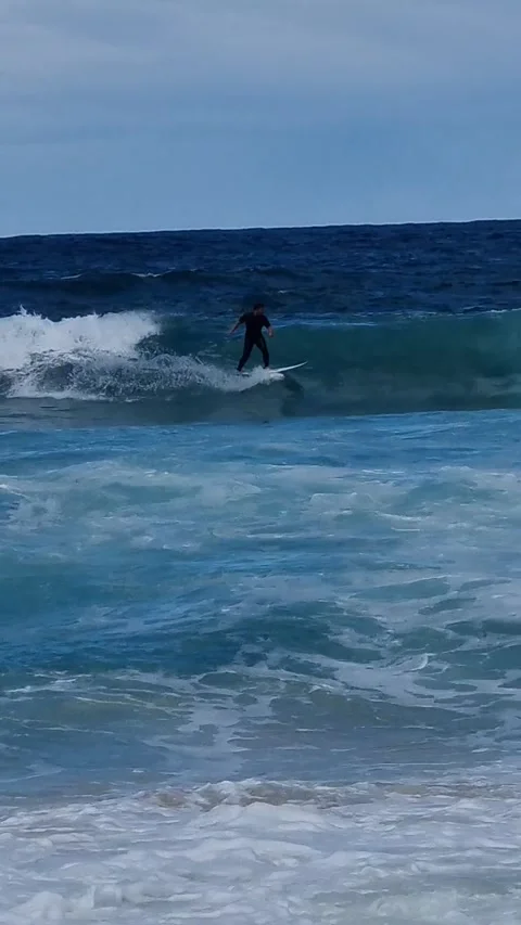 Great run in wild waves Stock Footage 249437167