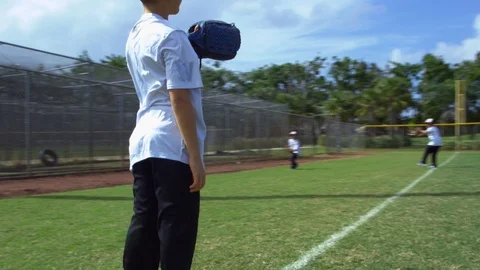 Great shot of kids throwing and catching during baseball practice Stock Footage 85642631