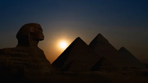 The Great Sphinx and Egyptian Pyramids of Giza at Sunset, Cairo, Egypt Stock Footage 110625403
