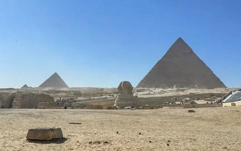 The Great Sphinx guards the pyramids of the pharaohs at Giza. Stock Photos