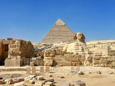 The Great Sphinx guards the pyramids of the pharaohs at Giza. Stock Photos