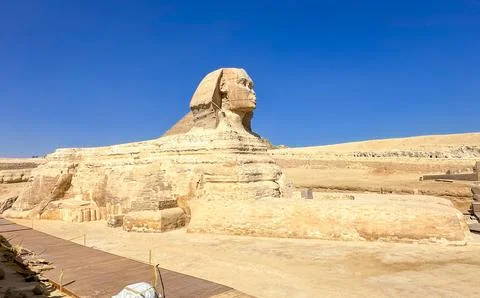 The Great Sphinx guards the pyramids of the pharaohs at Giza. Stock Photos
