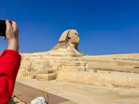 The Great Sphinx guards the pyramids of the pharaohs at Giza. Stock Photos