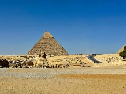 The Great Sphinx guards the pyramids of the pharaohs at Giza. Stock Photos