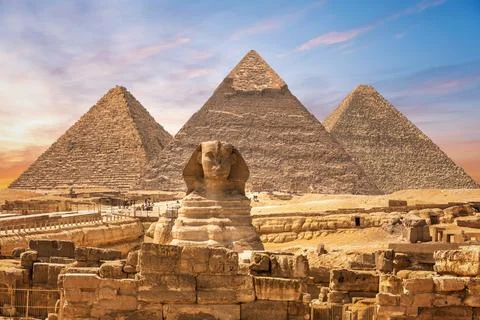 The Great Sphinx next to the Pyramids of Egypt in the sands of Giza desert Stock Photos