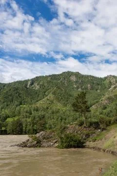 Great spring water on the Katun River and its surrounding mountains, Altai, R Stock Photos