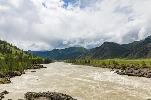 Great spring water on the Katun River and its surrounding mountains, Altai, R Stock Photos