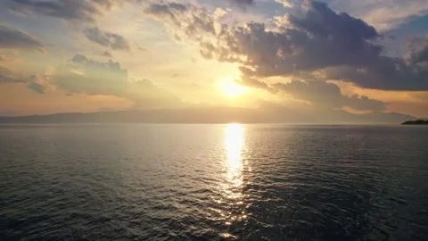 Great sunset on the lake. Camera moves over water surface against backdrop of Stock-Footage 157485816