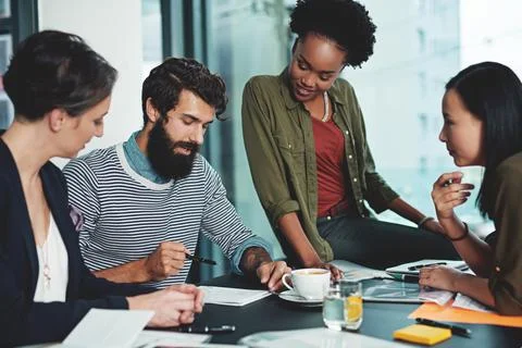 Great things happen when they compile their visions together. a group of Stock Photos