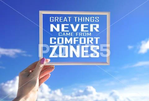 Great things never came from comfort zones. White frame in female hand ...