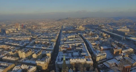 Great top view of roofs covered with snow. Drone footage of old buildings. Sunny Video stock 105247315