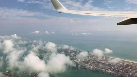 Great view from airplane as it leaves Miami. Wing of plane can be seen in shot. Stock Footage 83174166