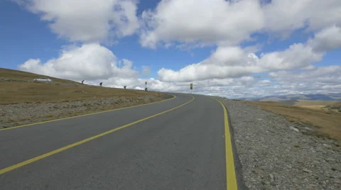 Great view of four longboarders speeding on Transalpina Stock Footage 57790559
