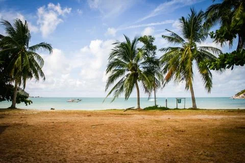 Great view over the sandy beach. Beautiful clouds in the blue sky. Islands .. Stock Photos