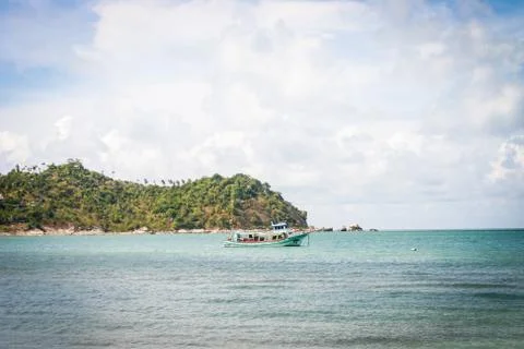 Great view over the sandy beach. Beautiful clouds in the blue sky. Islands .. Stock Photos