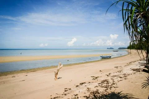 Great view over the sandy beach. Beautiful clouds in the blue sky. Islands .. Stock Photos