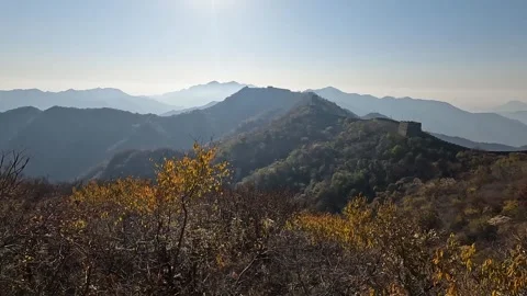 Great Wall of China watchtower window revealing autumn mountain landscape Video stock 336296232