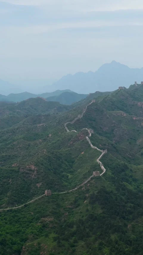 Great Wall of China winding over green mountain ridges Stock Footage 337651034