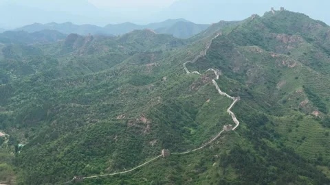 Great Wall of China winding over green mountain ridges Video stock 337651083