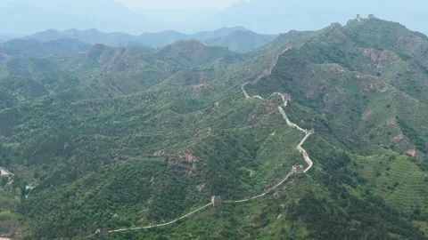 Great Wall of China winding over green mountain ridges Stock Footage 337651271