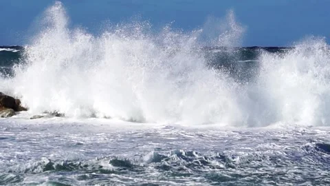 Great waves over wavebreaker, slow motion Stock Footage 183985708