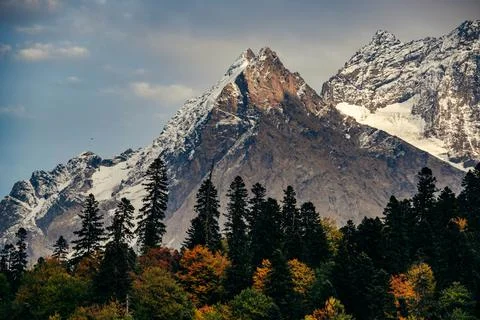 The greatness of the mountain in the rays of the sunset. Stock Photos