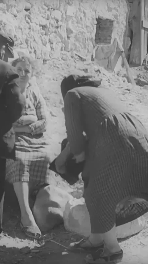 GREECE - 1940s - Cargo cranes are used to transport enormous crates on a Greek Stock Footage 342634466