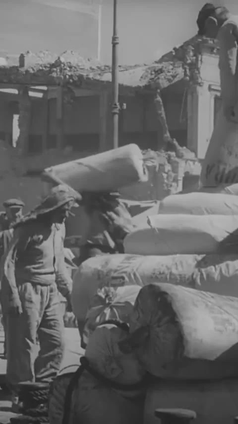GREECE - 1940s - Cargo is transported across a dock in Greece. Stock Footage 342634449