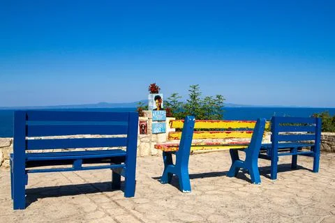 Greece, Afitos, benches in front of a work by Vassilis Pavlis facing the sea Stock Photos
