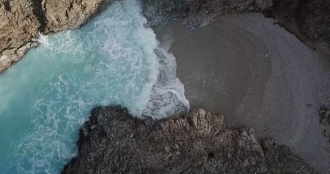 Greece Cliffs and Beach Rotating Drone Shot Stock Footage 106339481