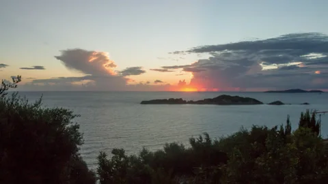 Greece, Corfu island. Sunset, clouds and sea. Time lapse UHD 4K. Stock Footage 119633481