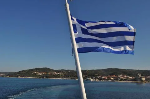 Greece flag on the flagpole Stock Photos