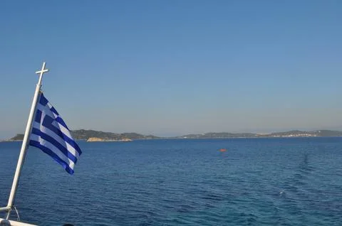 Greece flag on the flagpole Stock Photos