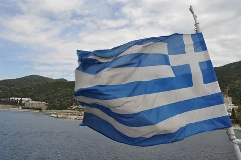 Greece flag on the flagpole Stock Photos