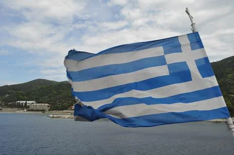 Greece flag on the flagpole Stock Photos
