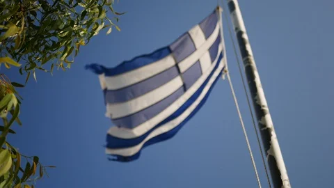 Greece flag waving on the wind druing windy day Stock Footage