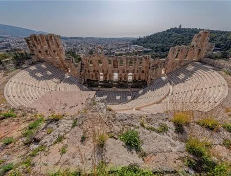 Greece, Herodium open odeon under Acropolis and Athens cityscape Stock Photos