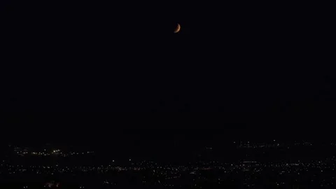 Greece: Partial lunar eclipse visible over Greek capital 動画素材 343820558