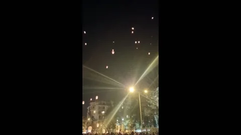 Greece: Protesters Release 57 Lanterns Into Sky In Memory Of Tempi Train Cra... Stock Footage 235350670