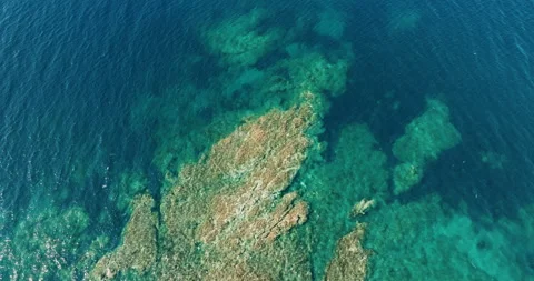 Greece Rocky coast of peninsula. Pattern of sea surface and rocky shore Stock Footage 238529904