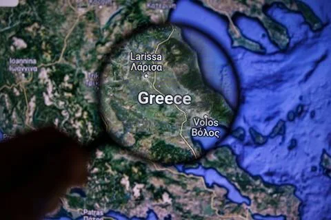 Greece on wildfire. Greece on maps through magnifying glass Stock Photos