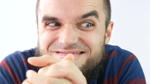 Greedy sly bearded man giggling and rubbing hands Stock Footage 72232968