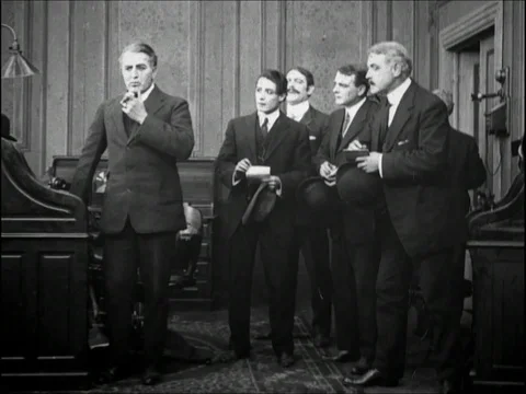 A greedy tycoon meets with his officers over the wheat production - 1909 Stock Footage