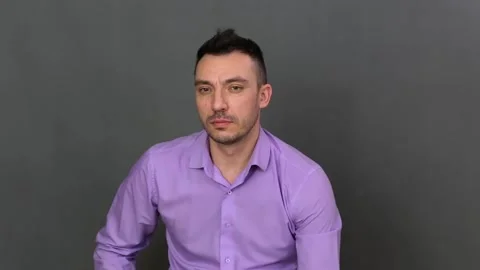 Greedy young man close-up Stock Footage 131295991