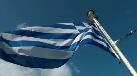 Greek flag on the background of sky Stockbeeldmateriaal 8985710