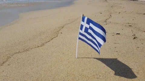 Greek flag on the beach Stock Footage 247714861