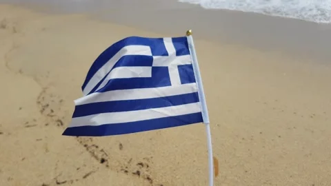 Greek flag on the beach Stock Footage 247715128