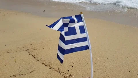 Greek flag on the beach Stock Footage 247842846